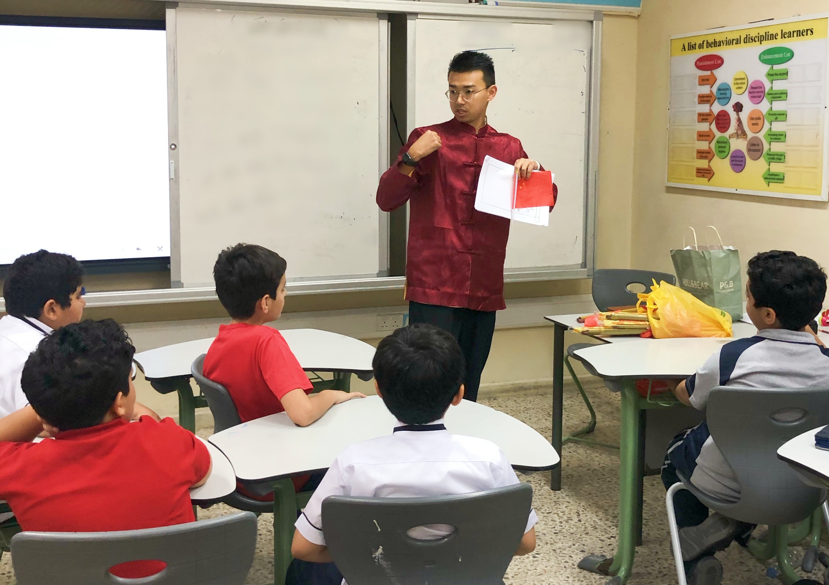 Dr. Shan Jin teaching Chinese in a classroom